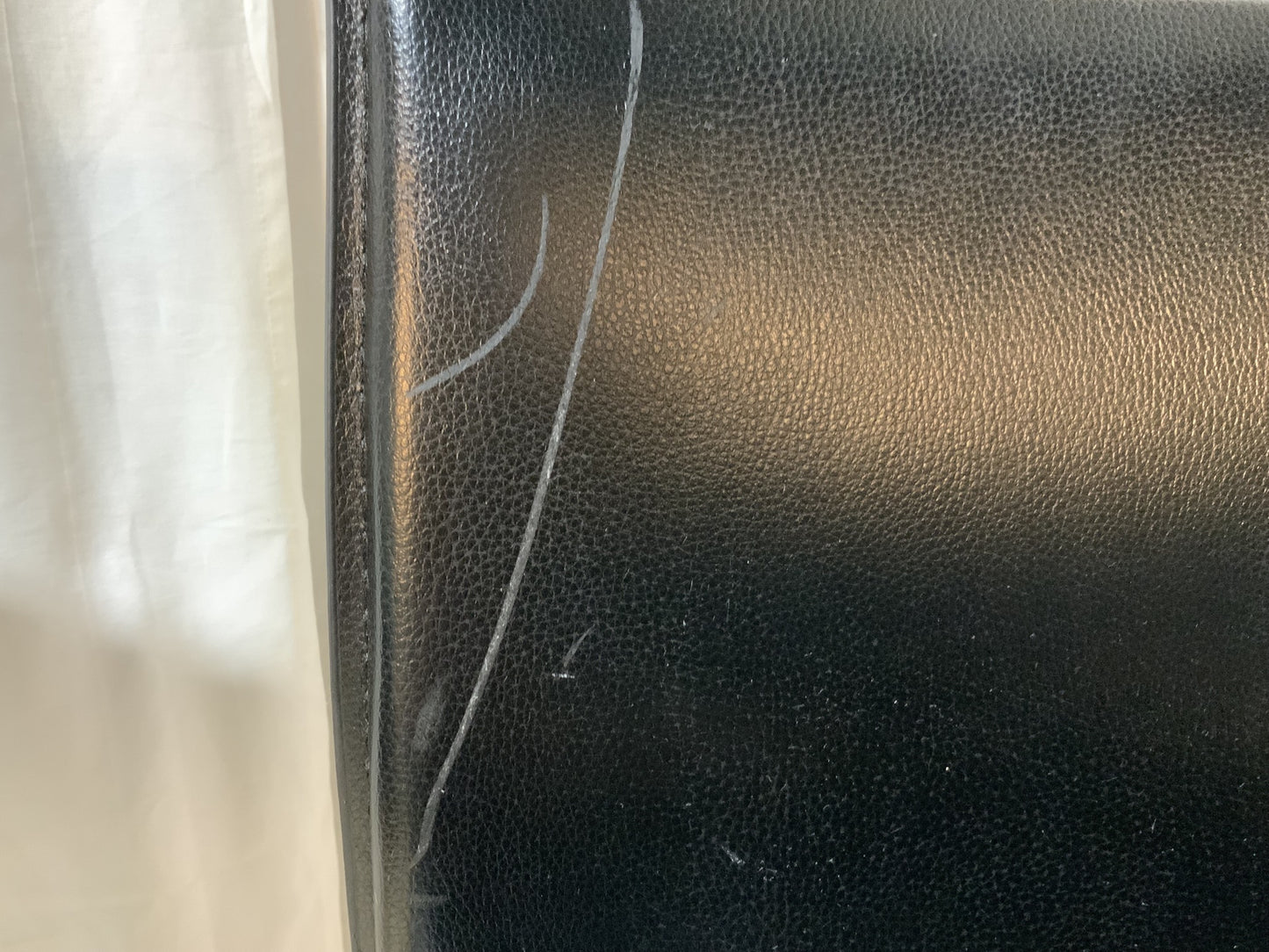 Black faux leather barstool