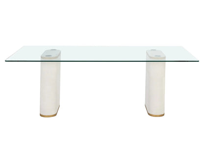 Aemond Dining Table, a rectangular clear glass tabletop that sits on two white concrete legs