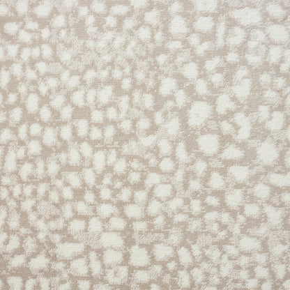 A close-up of a textured fabric or wallpaper pattern featuring an animal print motif in warm beige and off-white.
