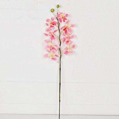 Artificial pink orchid flower stem on a white background