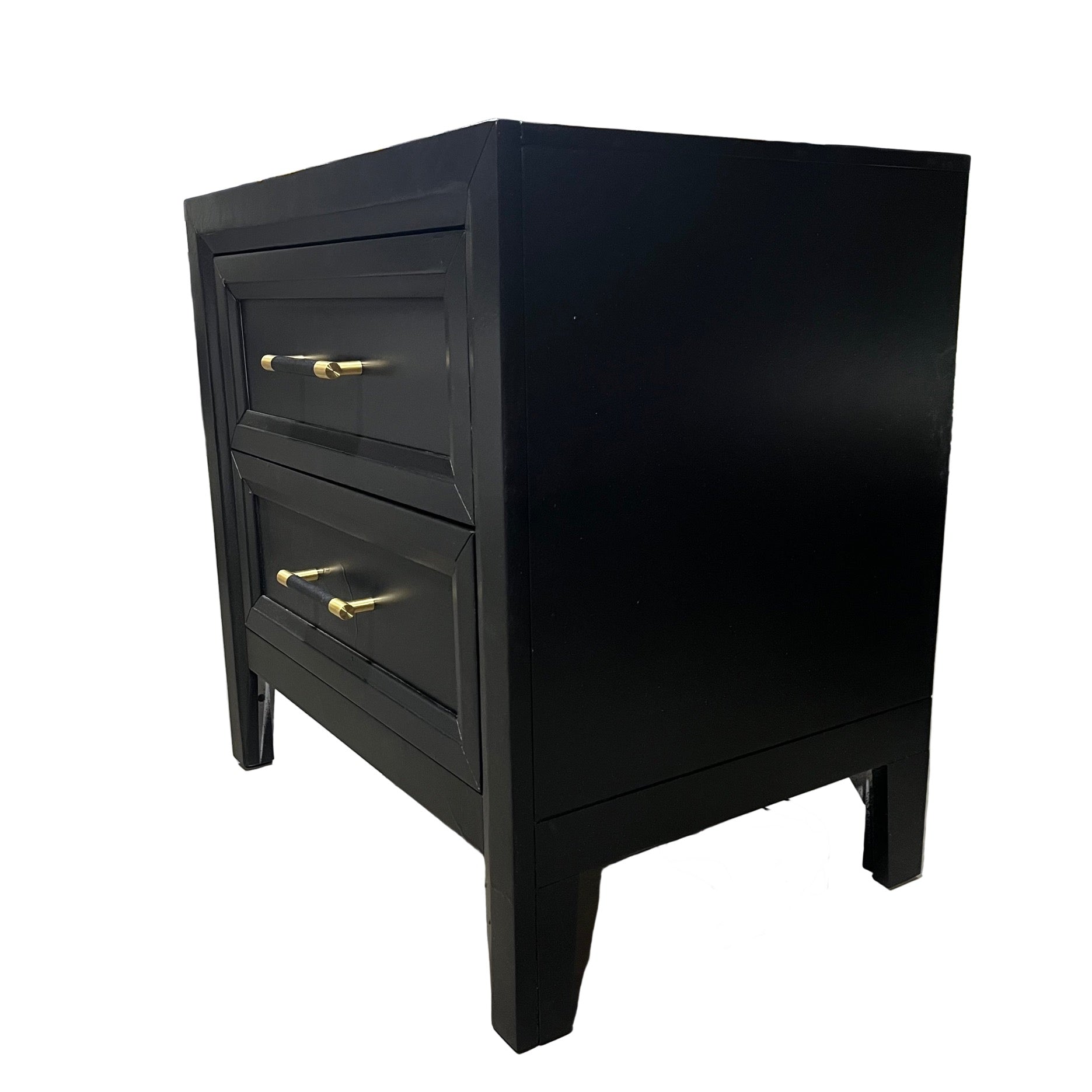 Black nightstand with two drawers and gold handles on a white background
