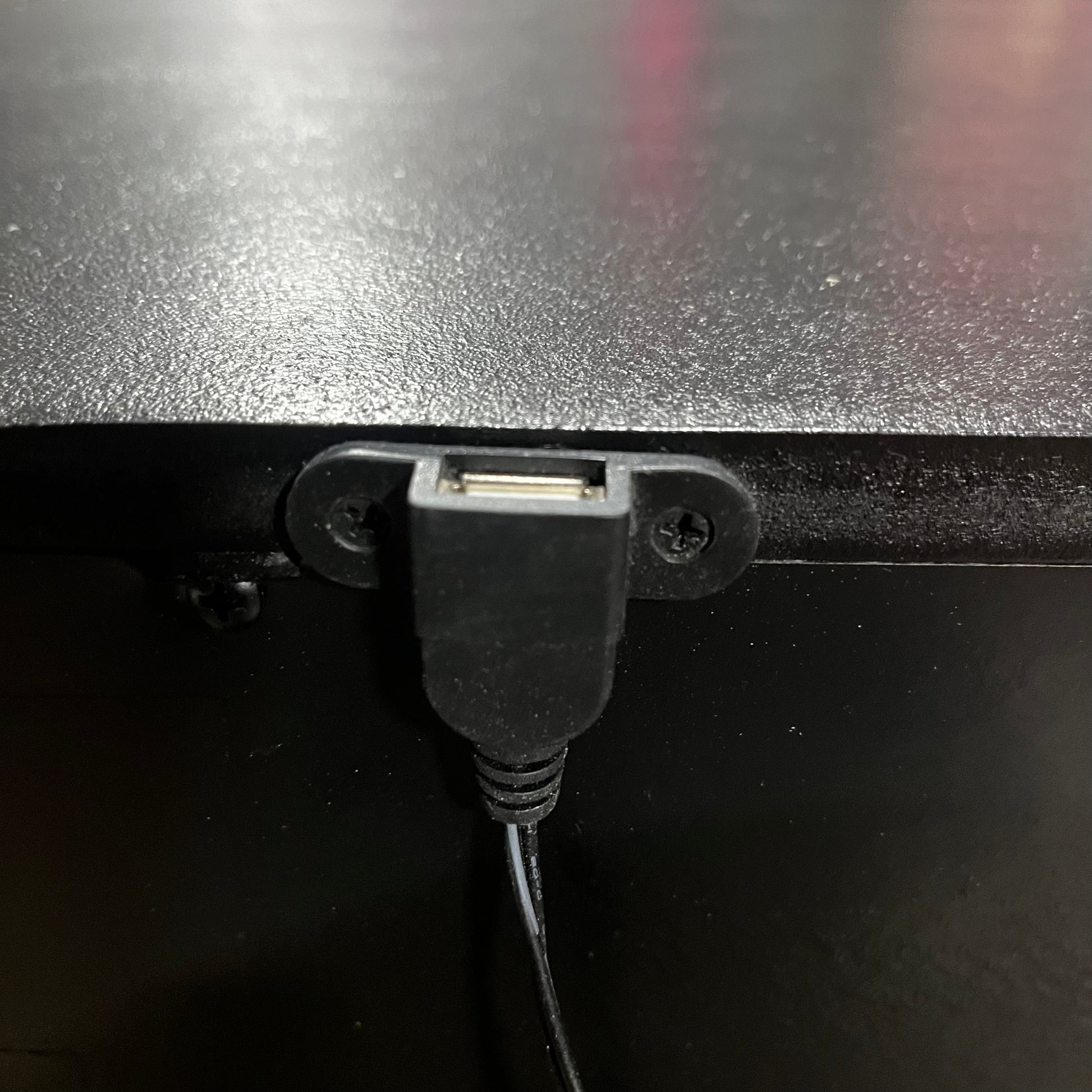 USB cable on a nightstand