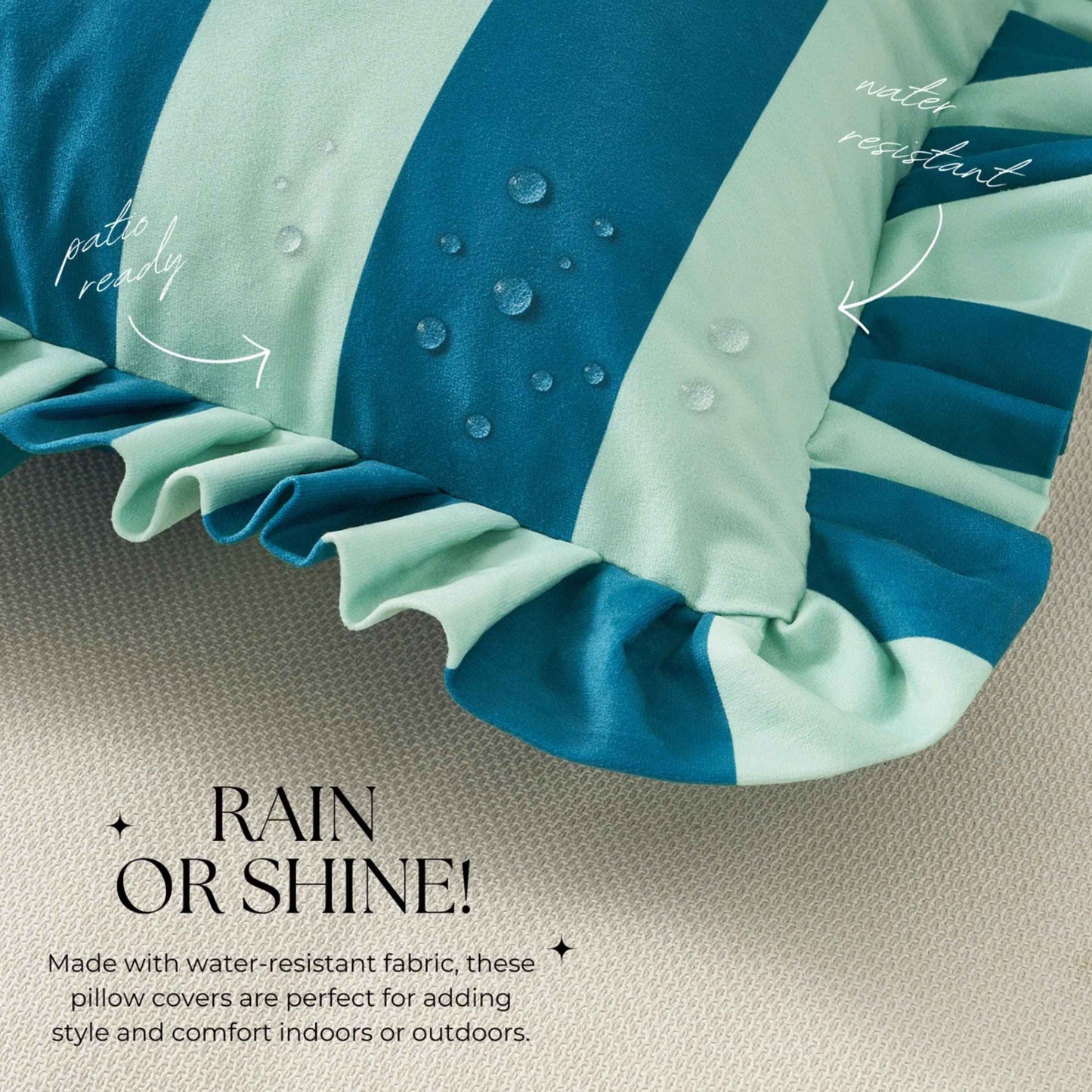 Close-up of a striped pillow cover in blue and light blue with a ruffled edge, shown on a textured beige surface. 
