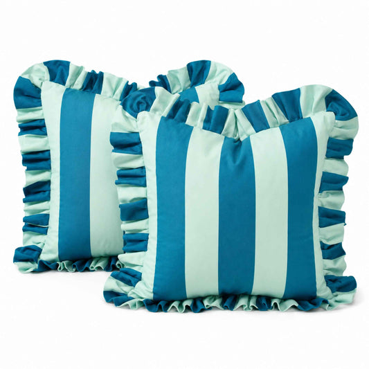 Two square decorative throw pillows with ruffled trim, featuring vertical stripes in blue and light blue, shown on a white background.