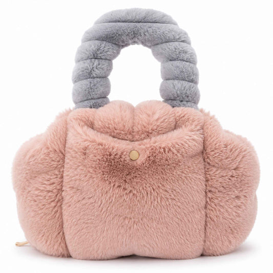 A plush, cloud-shaped Pur-Low in dusty pink faux fur with a matching gray ribbed handle and a small gold button closure on the front, set against a plain white background.