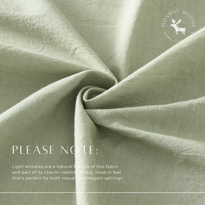 Close-up of green fabric with a 'Monday Moose' logo and text about fabric texture.