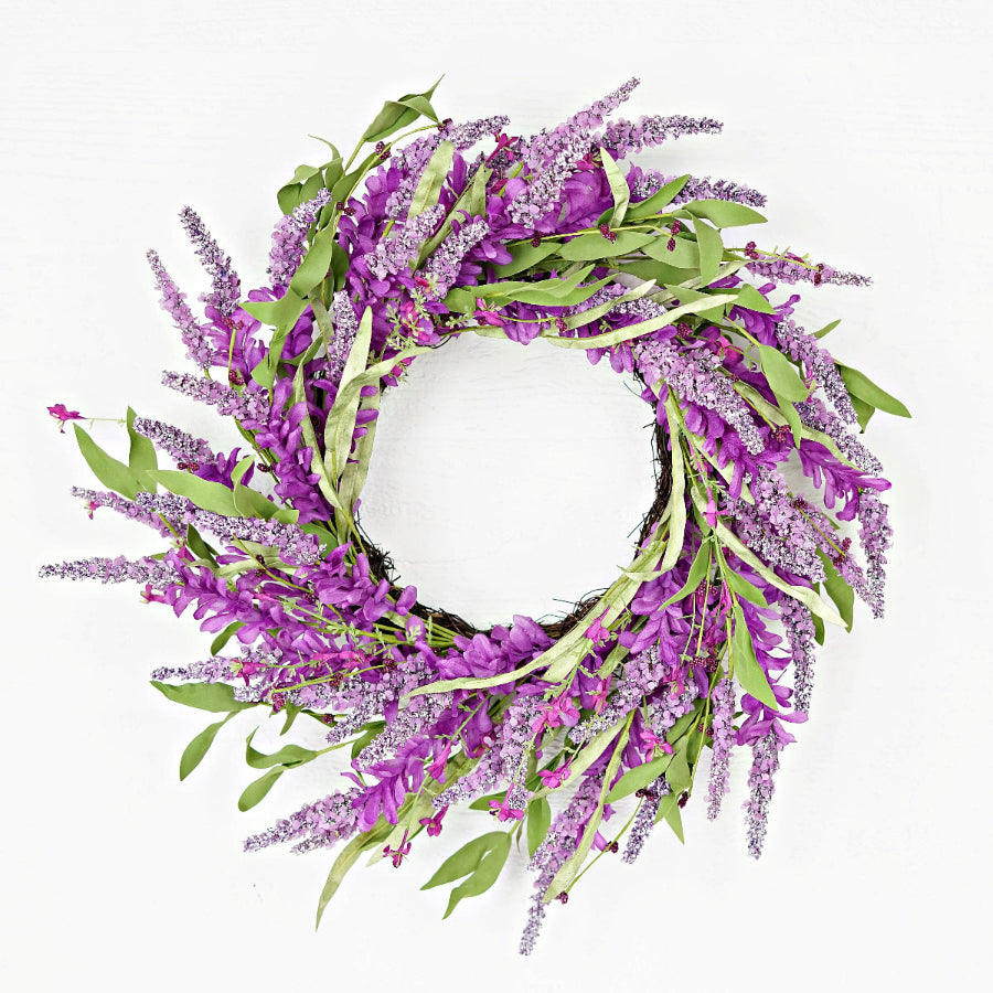 Floral wreath with purple flowers and green leaves on a white background