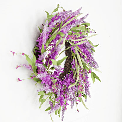 Purple floral wreath with green leaves on a white background