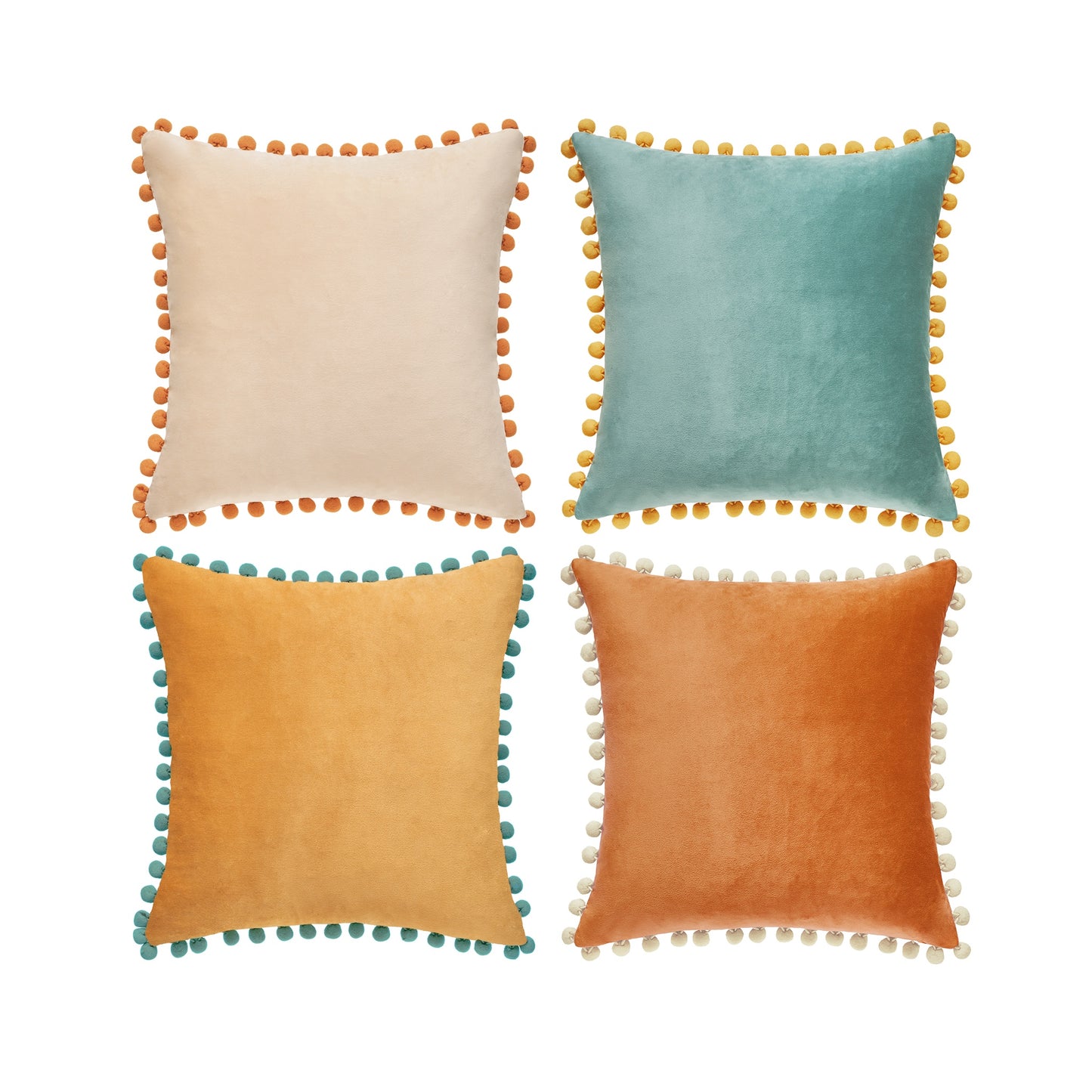 Four colorful pillows with pom-pom trim on a white background