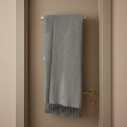 Gray throw blanket with tassels on a white background
