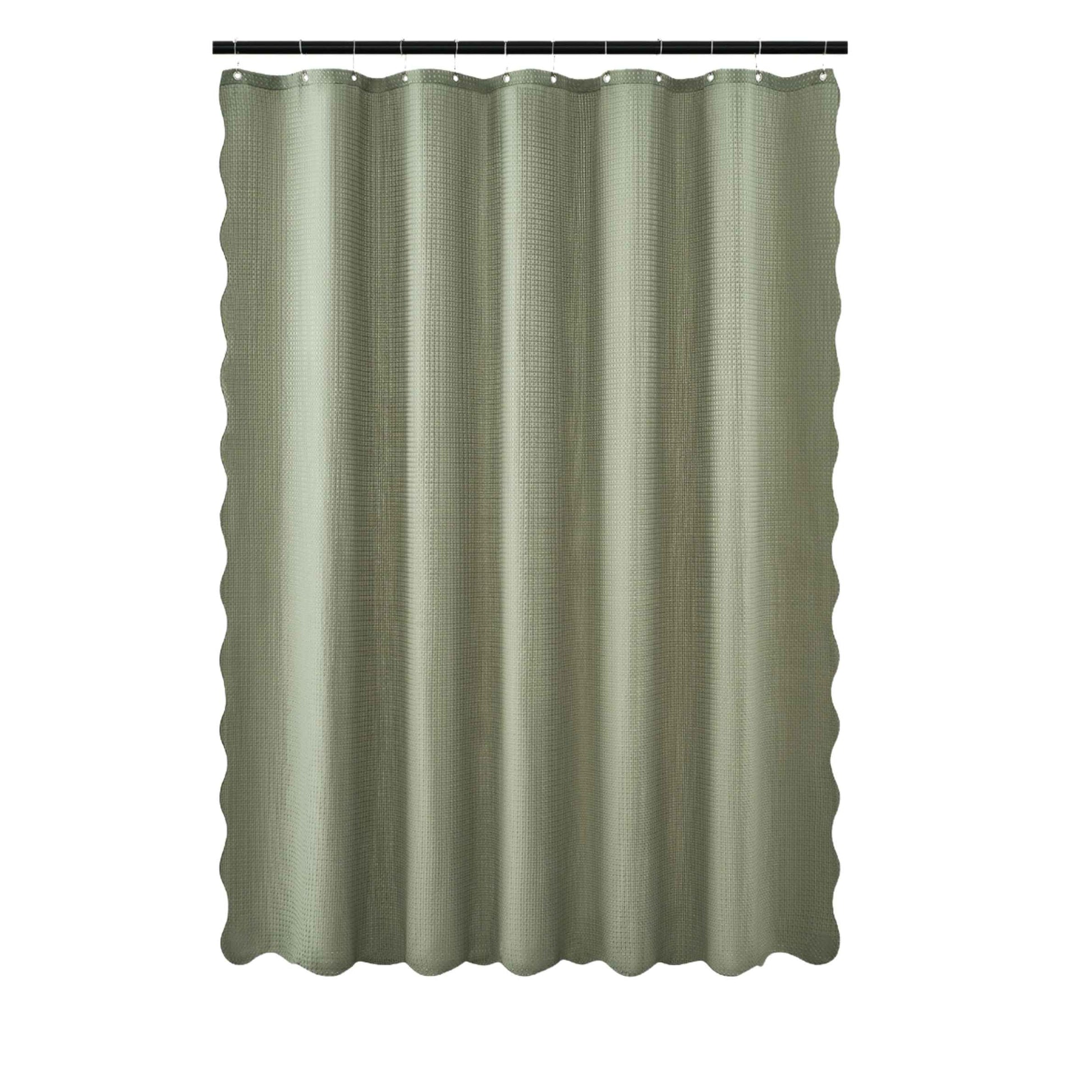 Green shower curtain with a textured pattern on a white background