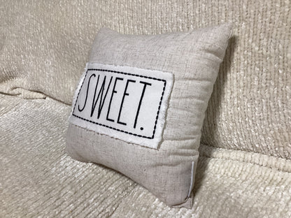 Tan “Sweet” pillow -open box-