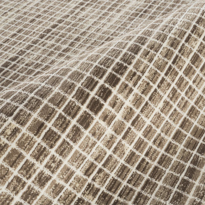 A close-up of a woven fabric with a textured grid pattern in brown and beige.