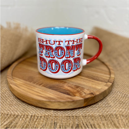 Mug with 'Shut the Front Door' text on a wooden tray