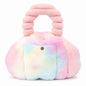 A fluffy rainbow Pur-Low with a rounded body, a small gold-tone front button, and a thick ribbed top handle. The bag has a soft tie-dye look blending pink, blue, yellow, and white, photographed on a clean white background.