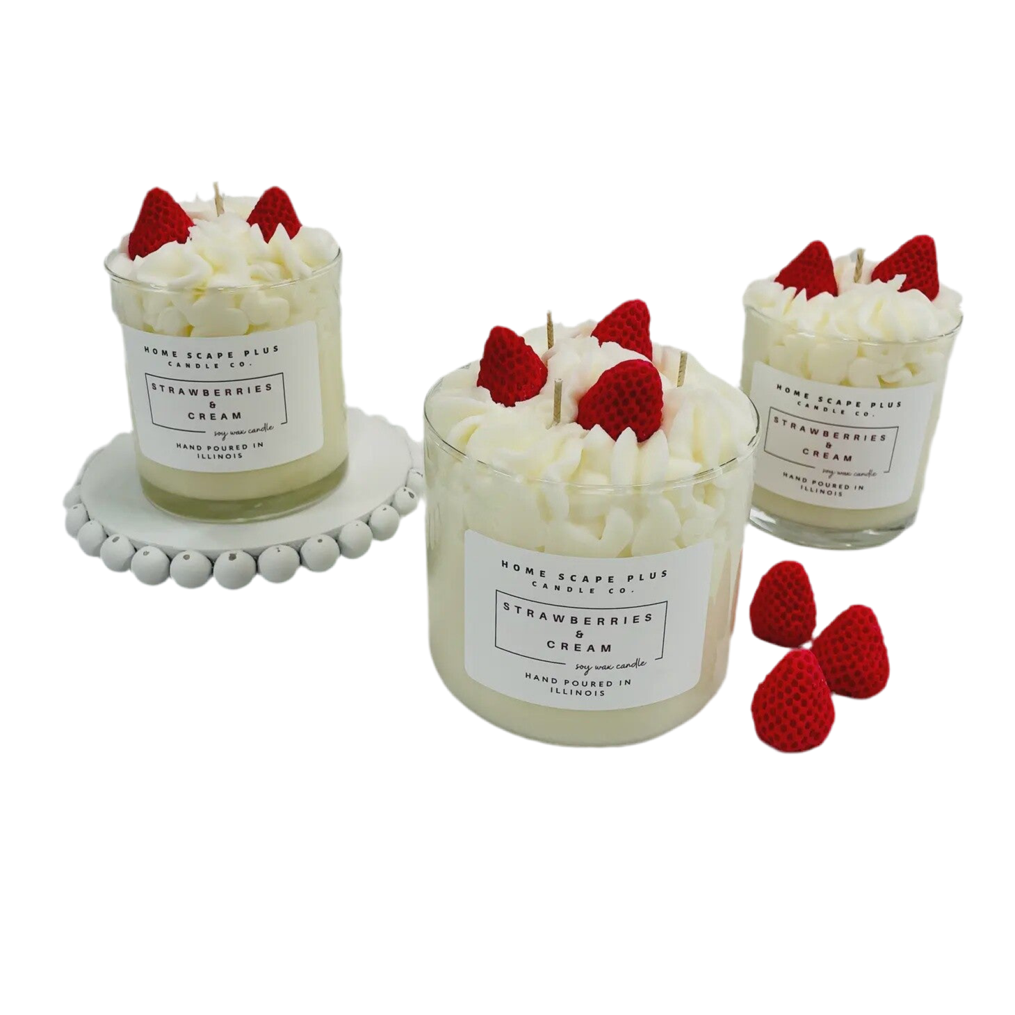 Three candles with whipped cream and strawberries on top, labeled 'Strawberries & Cream', on a white background.
