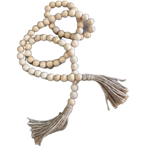 String of beige beads with tassels on a white background