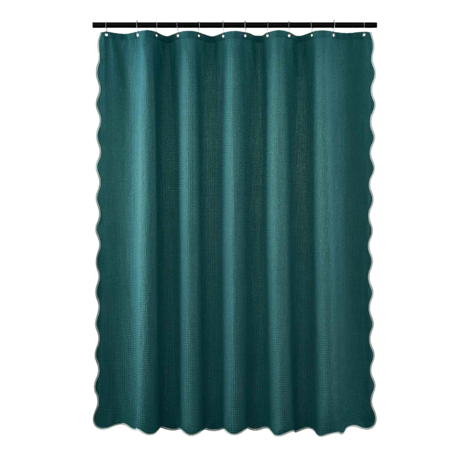 Teal shower curtain on a white background