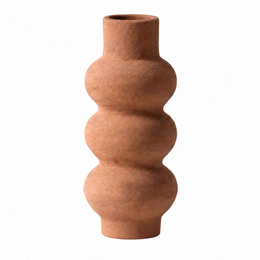 Terracotta vase with a textured surface on a white background