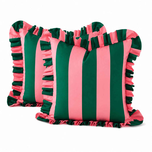 Two square decorative throw pillows with vertical pink and dark green stripes and ruffled trim, shown on a white background.