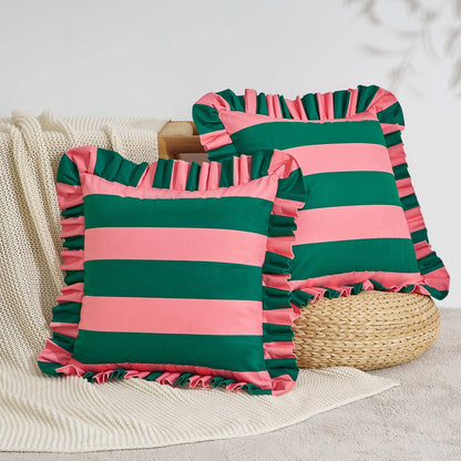 Two striped pillows with ruffled edges on a neutral background