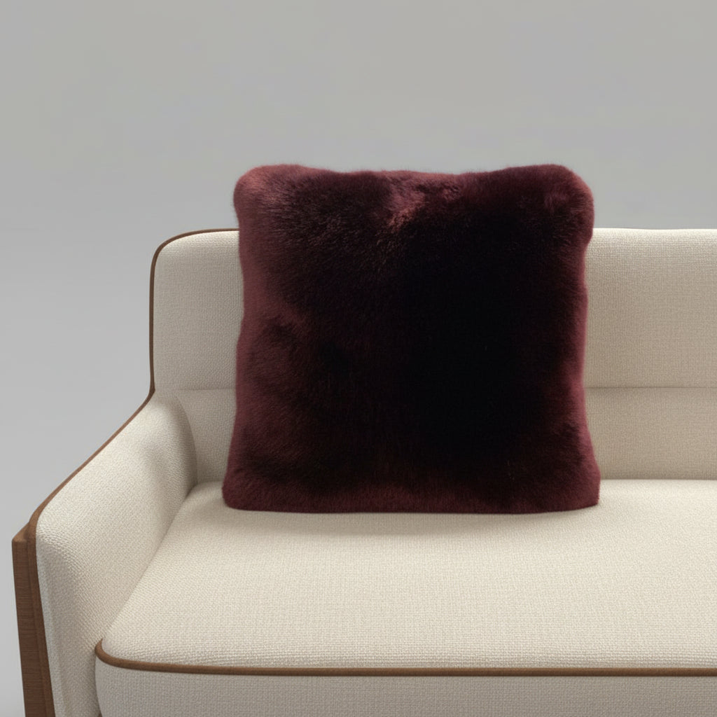 Luxuriously soft faux fur pillow in rich blackberry burgundy. Adds warmth, texture, and bold color to sofas or beds. Open box, final sale.