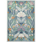 Decorative rug with floral and shell pattern on a blue background