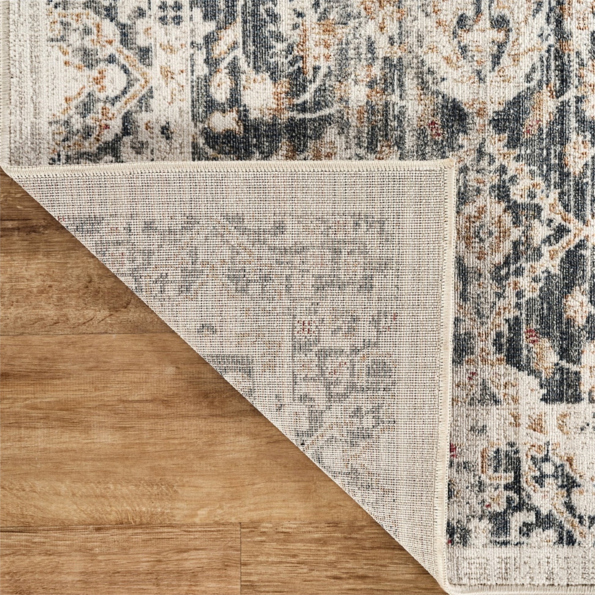 Patterned rug on a wooden floor