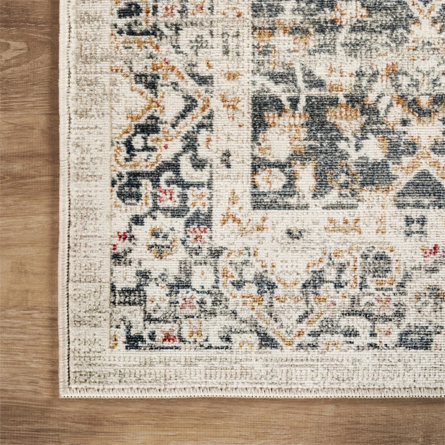 Patterned rug on a wooden floor
