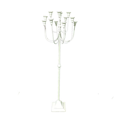 White candelabra with multiple candle holders.