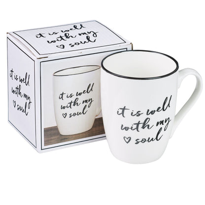 White mug with 'it is well with my soul' text in a matching box on a white background