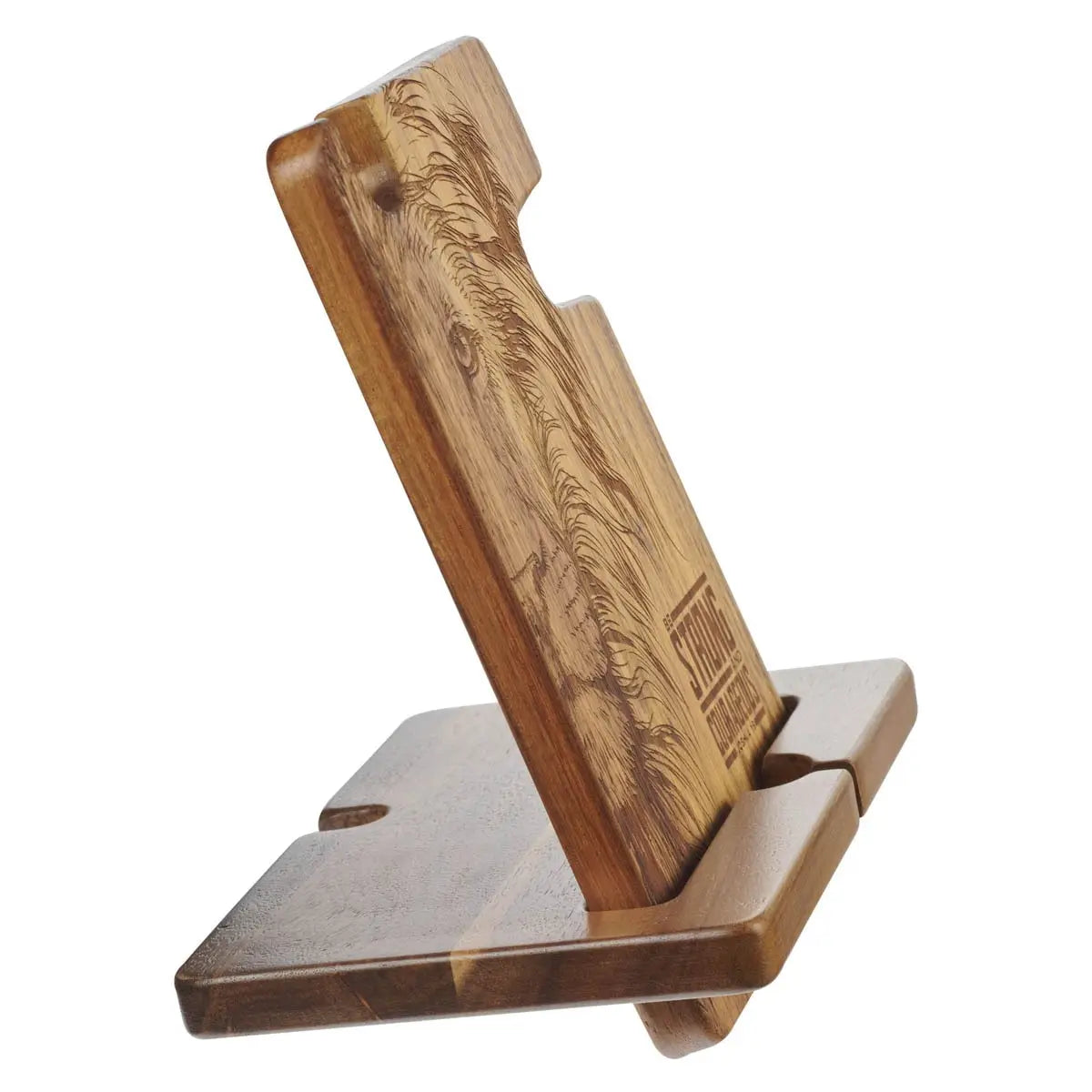 Wooden phone stand with engraved design on a white background