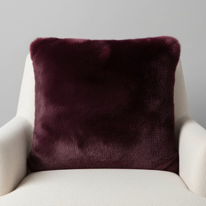 Luxuriously soft faux fur pillow in rich blackberry burgundy. Adds warmth, texture, and bold color to sofas or beds. Open box, final sale.