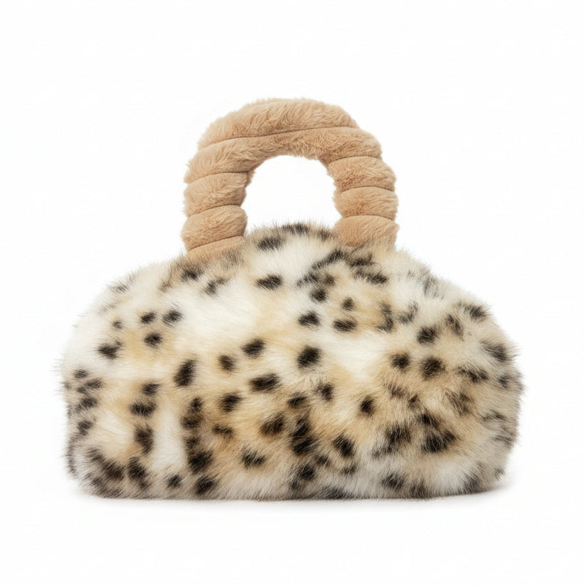 Leopard print handbag with beige handle on a white background