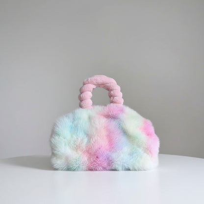 Multicolored fluffy handbag with a handle on a white background