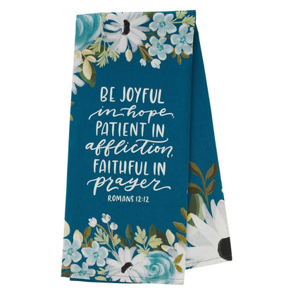 Floral-themed towel with motivational quote on a white background
