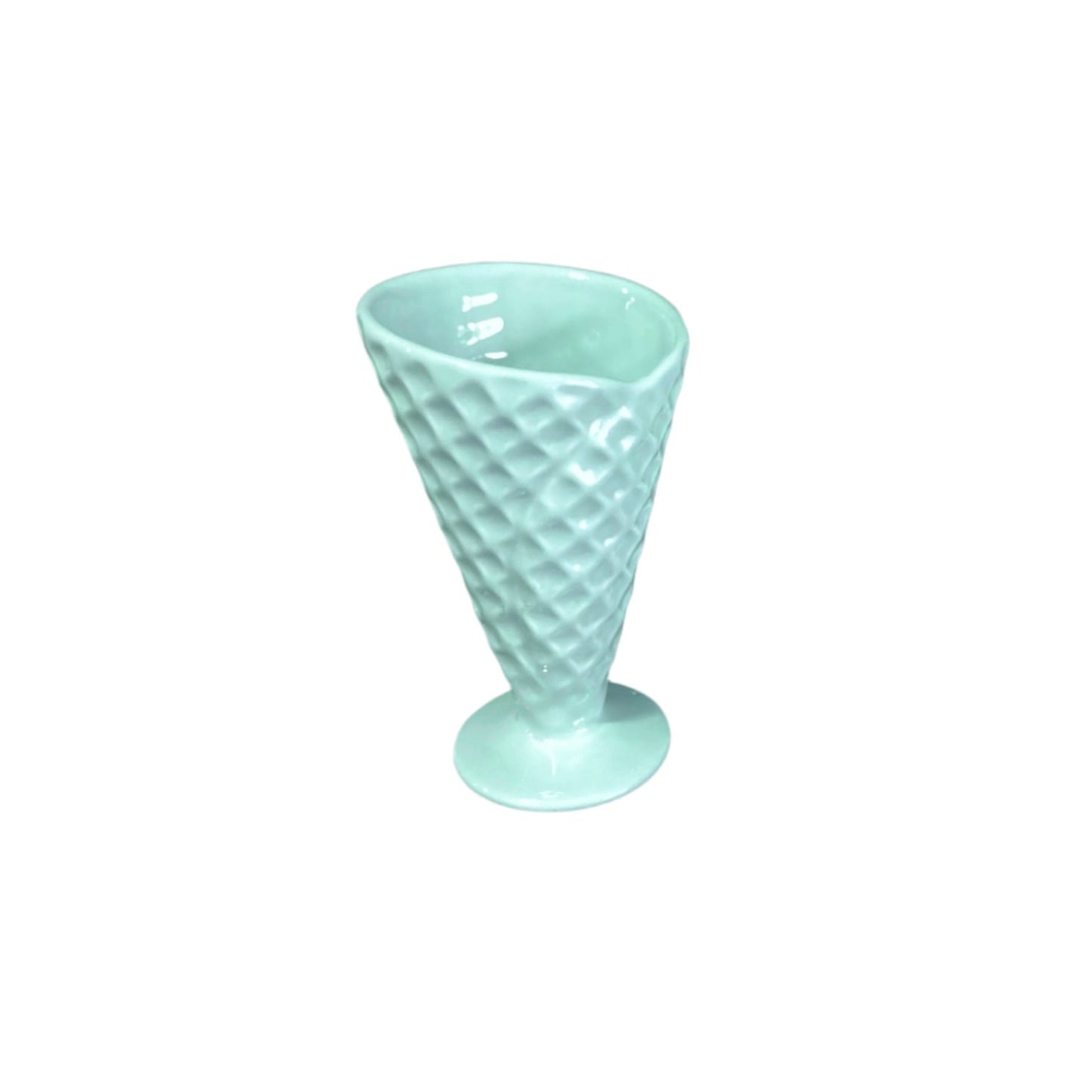 Mint green textured glass cup on a white background