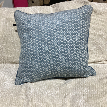 light blue and white decorative pillow