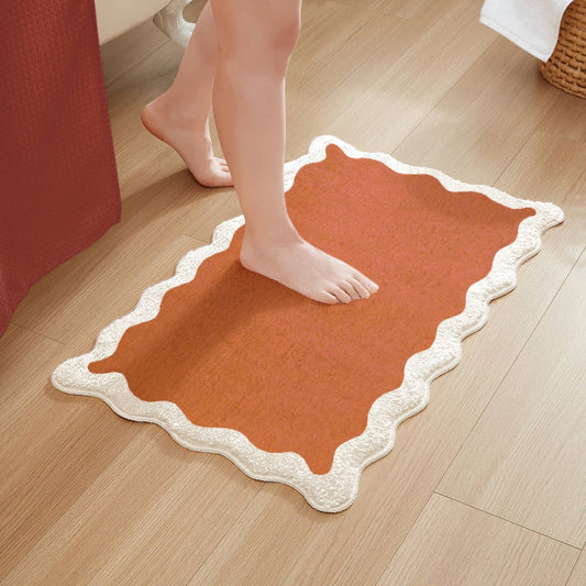 orange scalloped bath mat