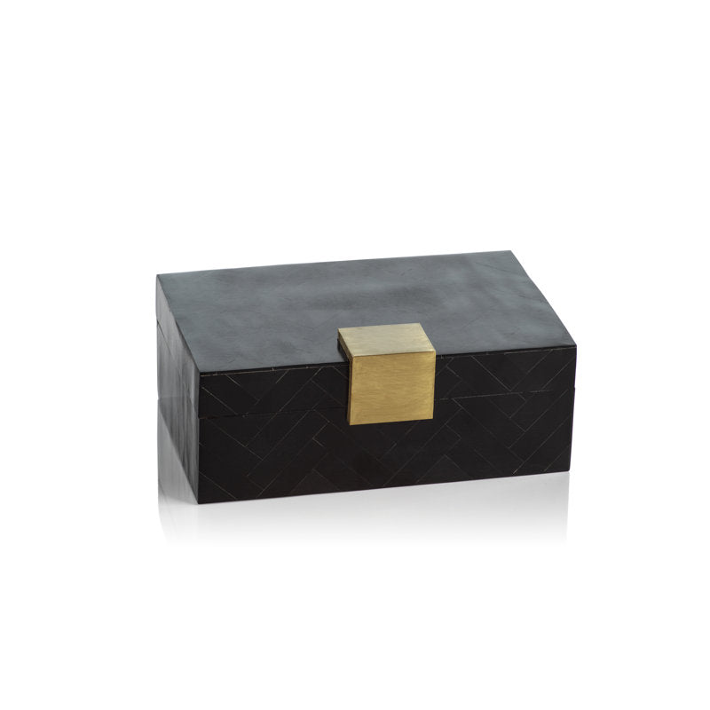 Black rectangular box with gold latch on white background